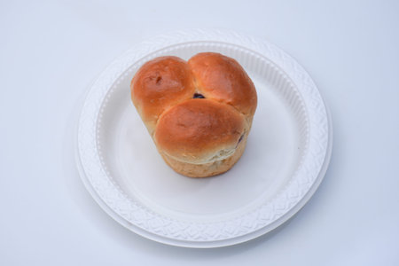 Market snack bread filled with jam on a white background