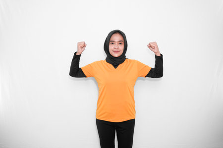 Gymnastics warm-up expression with strong signs of women wearing hijabの写真素材