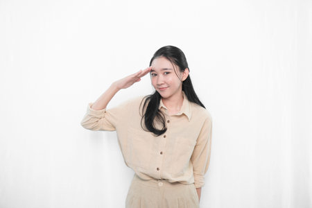 Expression of Indonesian Asian model woman in white dress smiling and respectful attitude