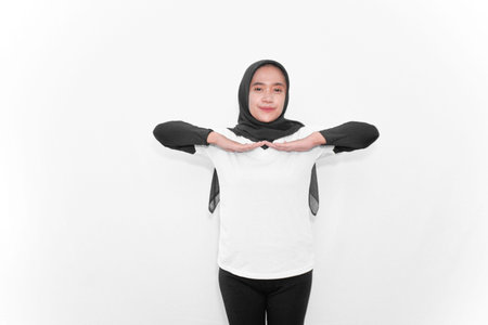 Gymnastic movements of women wearing hijabs bending both hands to the side