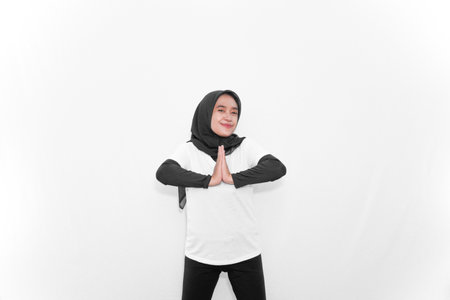 Women in hijab in white clothes doing gymnasticsの写真素材