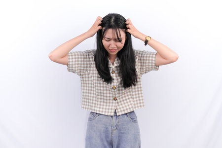 Indonesian Asian woman in white checkered shirtの写真素材