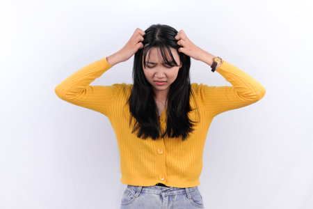Indonesian Asian woman in yellow dress
