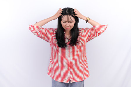 Indonesian Asian woman in red striped dressの写真素材