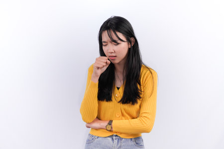 Asian Indonesian woman wearing yellow dressの写真素材