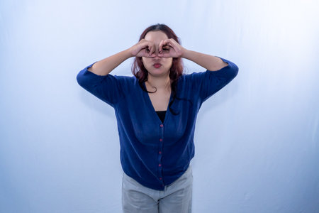 An Indonesian Asian woman in a blue dress is posing.の写真素材