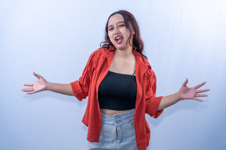 Indonesian Asian woman in orange jacket is surprised