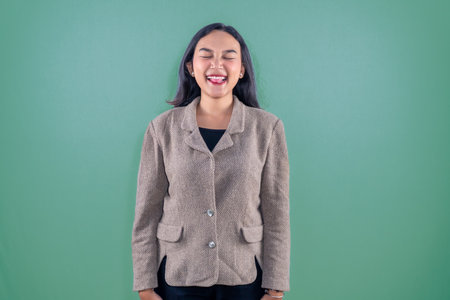 Asian Indonesian woman wearing a brown suitの写真素材