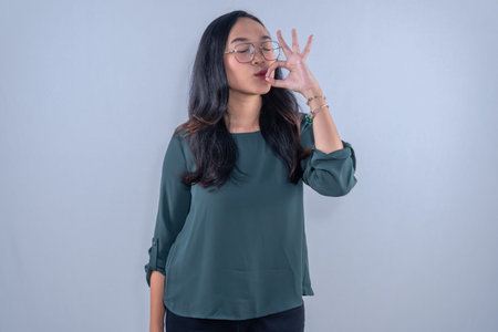 Indonesian Asian woman wearing green clothes