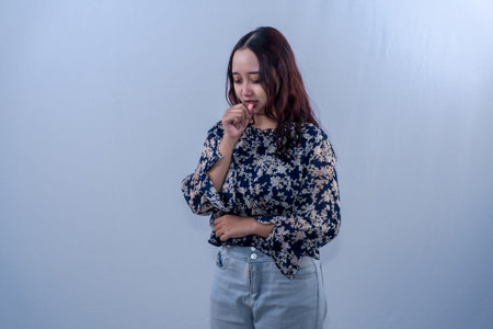 Indonesian Asian woman wearing black floral patterned dress