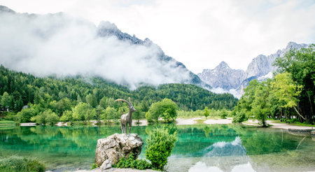 Zelenci pond and Julian Alps in Kranjska Gora, Sloveniaの写真素材