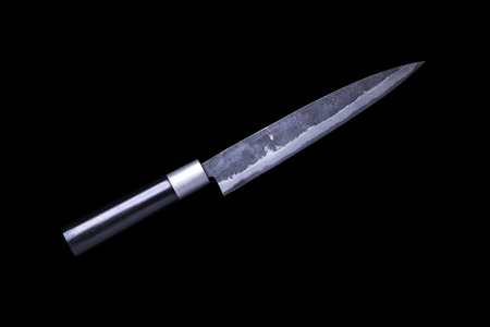 Japanese kitchen knife, yanagi sashimi knife isolated on black backgroundの写真素材