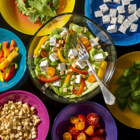 Top view on caesar salad and its ingredientsの写真素材