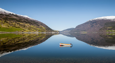 Nordfjord panorama with boat and water reflection, Norwayの写真素材