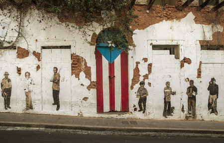 San Juan, Puerto Rico - June 25, 2015: Graffiti and puerto rican flag painted on the door in Old San Juan, Puerto Ricoのeditorial素材