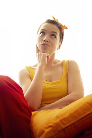 Attractive woman hesitating isolated on white backgroundの写真素材