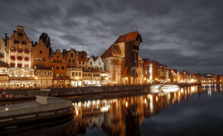 Gdansk, Poland - October 05, 2020: Old town of Gdansk city with the Crane at Motlawa river by night, Polandのeditorial素材