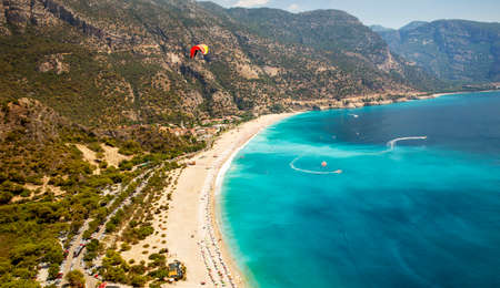 Paragliding over the beach in Oludeniz, Turkeyの写真素材