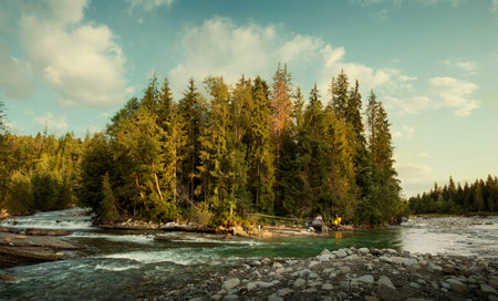 Camping of a recluse in the wilderness at the river bend
