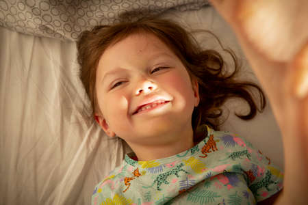 Adorable carefree baby girl smilingの写真素材