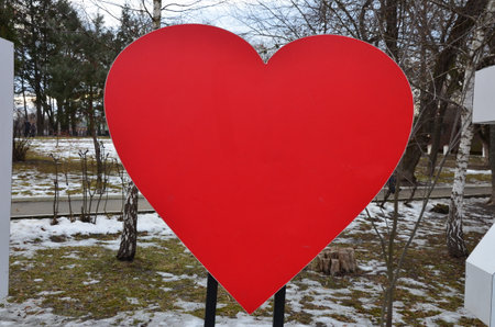 Valentine's Day. Big heart amid trees in winter.の写真素材