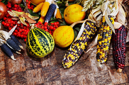 Happy Thanksgiving Day background, wooden table decorated with Pumpkins, Corncob, Candles and garland. Halloween. Beautiful Holiday Autumn festival concept scene Fall, Harvestの写真素材