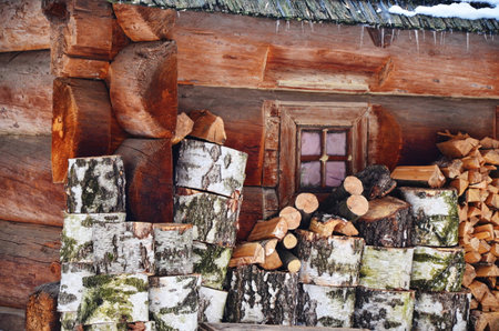 Large and picturesque pile of sawn birch trunks prepared for stabbing and heating of residential buildings.の写真素材