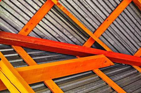 Inner view of the attic and its structures made of wood and metal