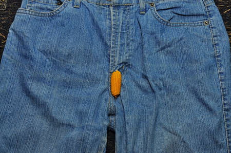 The corn fruit on the trousers symbolizes the man 's erotic power. Men have health problems. Erotica and sex in symbols.の写真素材