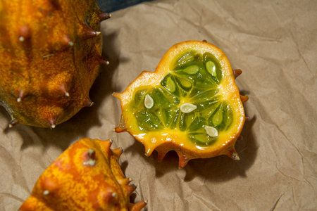 Sliced Fruit Kivano (Kiwano) melon on wooden background. Close up.の写真素材