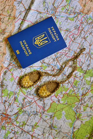 Passports of Ukraine on the travel map. Souvenir noodles as a gift to the traveler.