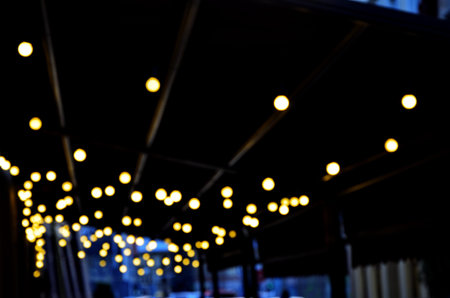 Christmas decorations on the street, colorful holiday bokeh lights, city night illumination,...