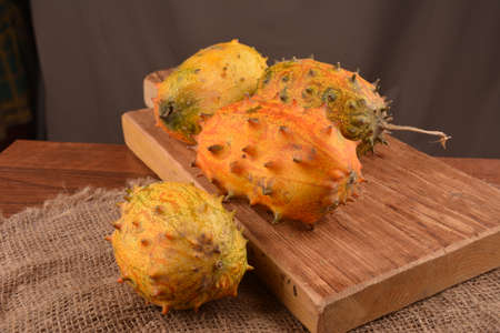 Sliced Fruit Kivano (Kiwano) melon on wooden background. Close up.の写真素材
