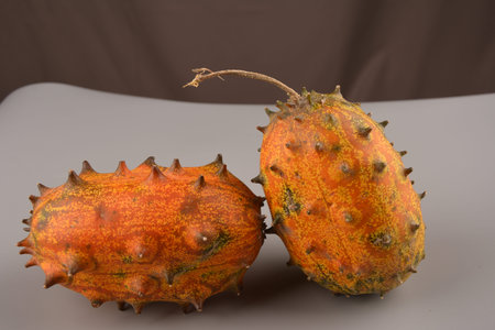 Sliced Fruit Kivano (Kiwano) melon on wooden background. Close up.の写真素材