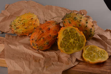 Sliced Fruit Kivano (Kiwano) melon on wooden background. Close up.の写真素材