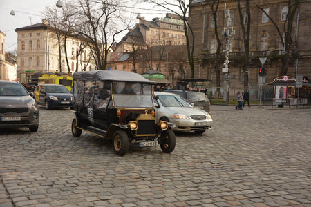 Lviv. Ukraine. January, 2021: tourist retro electric car.Sightseeing electric car styled vintage...