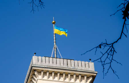 Awesome close-up view of the Lviv town hall tower from the roof of House of Legends cafe. Summer photo with the blue cloudy sky.の写真素材