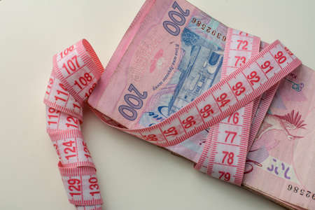 Photo hryvnia. Inflation. Price increase. The greedy concept of corruption. Bribe an idea. The economic crisis, unemployment. White backgroundの写真素材