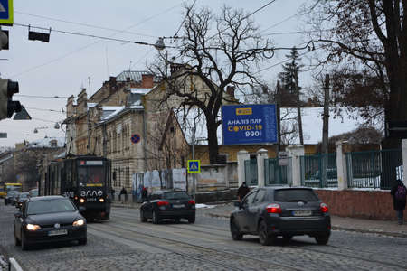 Lviv. Ukraine. February 2021.Lab advertisement for covid-19 tests. Billboard laboratory "Senevo" on the streets of Lviv.のeditorial素材