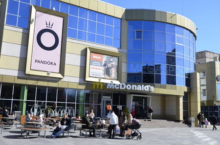 Rivne, Ukraine - March 2021.Contemporary McDonald's Restaurant Exterior. Illustrative editorial of McDonalds sign over the shopping mall entrance.McDonald's fast food restaurant - window with logoのeditorial素材