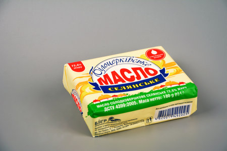 Lviv. Ukraine. February 2021.Wrapped butter sticks, isolated on white.Ukrainian manufacturer.Butter Belotserkovskoye 72%.のeditorial素材