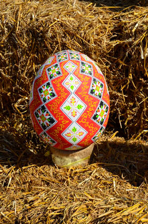 City center decoration with big painted red easter eggs during the easter time in 2021. Easter 2021 in Zdolbunov.のeditorial素材