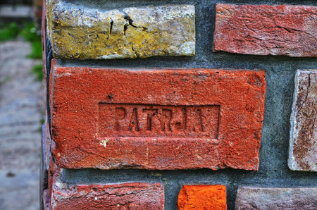 Lviv. Ukraine. March, 2021. Examples of ancient brick with an embossed display of the stigma of manufacturers. Artifacts on the brick.のeditorial素材