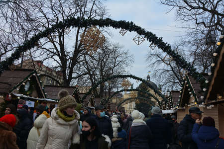Lviv. Ukraine. January 2021.beautiful city center and wooden cabins for market covered in snow. snowy town square in Lviv. european city before christmas holidaysのeditorial素材