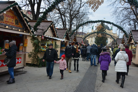 Lviv. Ukraine. January 2021.beautiful city center and wooden cabins for market covered in snow. snowy town square in Lviv. european city before christmas holidaysのeditorial素材
