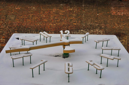 The city flower clock is covered with snow. Winter time in the urban environment.