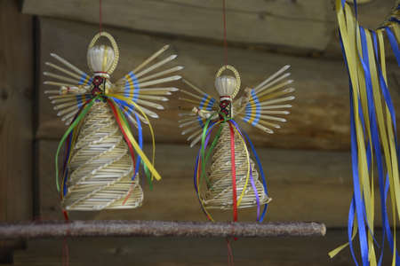 Straw angel inside the christmas decoration. Straw Angels Decorations for Christmas and New Year.の写真素材