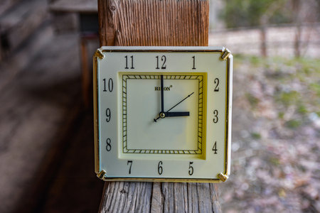 Kiev. Ukraine. March, 2022.Daylight Saving Time (DST). Blue sky with white clouds and clock. Turn time forward (+1h).の写真素材