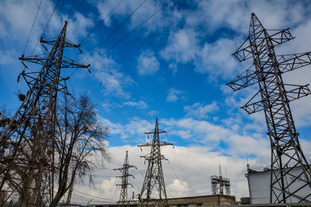 Power Transmission Line .High voltage power lines pylons and electrical cables on a clear blue sky...
