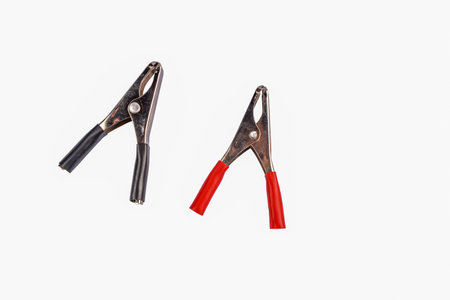 black and red electrical clamps isolated on white background .Electrical connectors with clamps for...